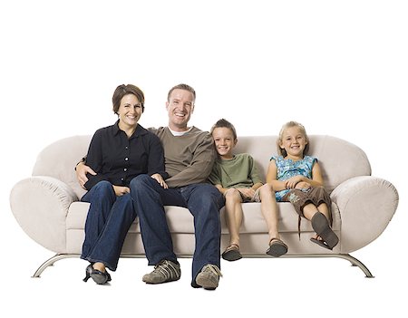 family studio shot - Family sitting on a couch. Stock Photo - Premium Royalty-Free, Code: 640-02656180
