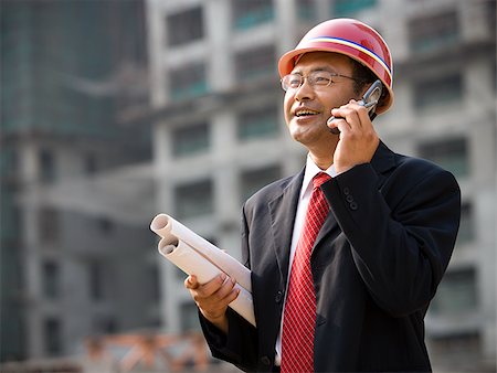 Architect on the job site. Stock Photo - Premium Royalty-Free, Code: 640-02656206