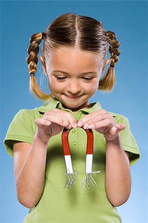 Child holding a magnet. Stock Photo - Premium Royalty-Free, Code: 640-02656263