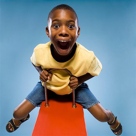 Child riding on a see saw. Foto de stock - Sin royalties Premium, Código: 640-02656274