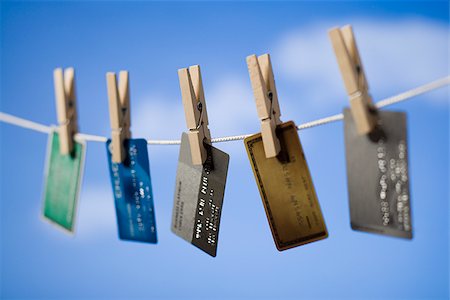 simsearch:640-02656364,k - Credit cards hung out to dry. Stock Photo - Premium Royalty-Free, Code: 640-02656360