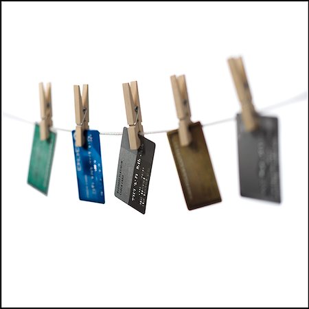 simsearch:640-02656364,k - Credit cards hung out to dry. Stock Photo - Premium Royalty-Free, Code: 640-02656362