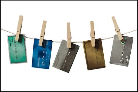 simsearch:640-02656364,k - Credit cards hung out to dry. Stock Photo - Premium Royalty-Free, Code: 640-02656363