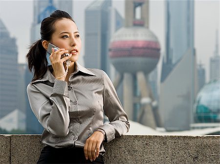 simsearch:640-02949616,k - Woman with a cell phone. Foto de stock - Royalty Free Premium, Número: 640-02656375