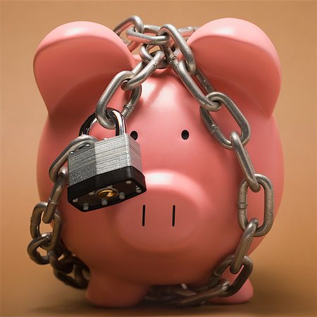 Piggy bank locked up. Stock Photo - Premium Royalty-Free, Code: 640-02656413