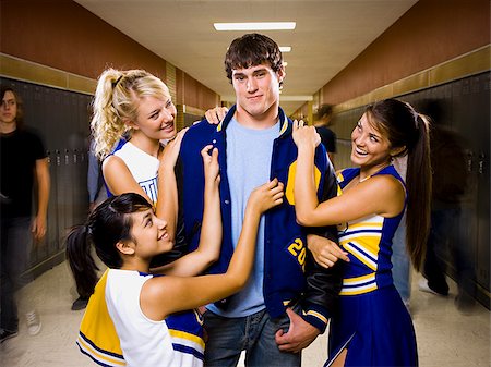 quarterback - Three female and one male High School Students. Fotografie stock - Premium Royalty-Free, Codice: 640-02656524
