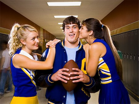 quarterback - Two female and one male High School Students. Fotografie stock - Premium Royalty-Free, Codice: 640-02656521