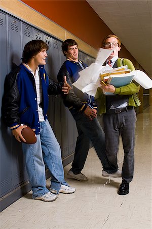 football players bullying nerds - High School Jocks and a Nerd. Stock Photo - Premium Royalty-Free, Code: 640-02656531