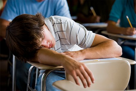 sleeping in a classroom - Student in a classroom. Stock Photo - Premium Royalty-Free, Code: 640-02656588