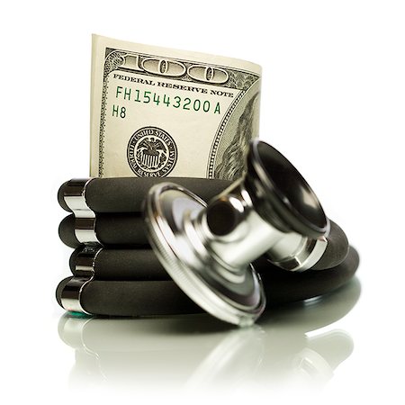 Money wrapped in a stethoscope. Stock Photo - Premium Royalty-Free, Code: 640-02656918