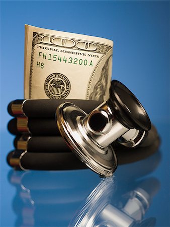 Money wrapped in a stethoscope. Stock Photo - Premium Royalty-Free, Code: 640-02656919