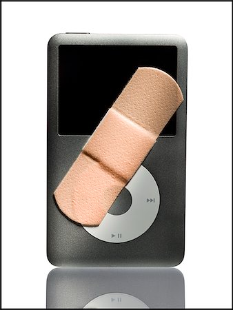 Band-aid on an Ipod. Stock Photo - Premium Royalty-Free, Code: 640-02656942