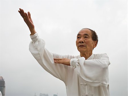 Seniors practicing tai chi. Stock Photo - Premium Royalty-Free, Code: 640-02657032