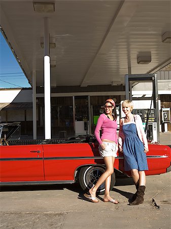 two women at a gas station. Stock Photo - Premium Royalty-Free, Code: 640-02657115