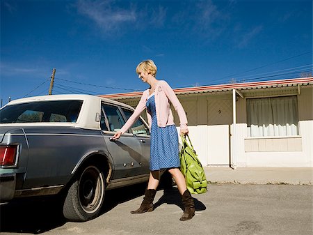 woman getting into an old car. Stock Photo - Premium Royalty-Free, Code: 640-02657123