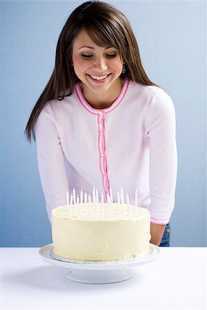 simsearch:640-02655752,k - Young woman with a cake. Stock Photo - Premium Royalty-Free, Code: 640-02657154