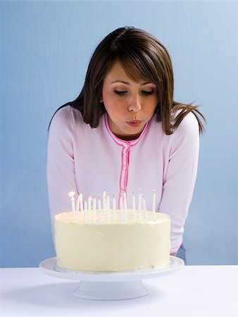 simsearch:640-02655752,k - Young woman with a cake. Stock Photo - Premium Royalty-Free, Code: 640-02657156