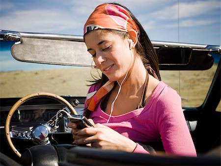 woman in a red convertible Stock Photo - Premium Royalty-Free, Code: 640-02657596