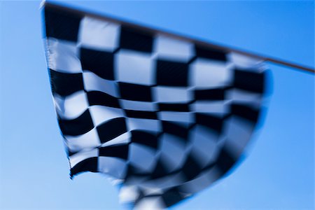 checkered flag being waved Stock Photo - Premium Royalty-Free, Code: 640-02657837