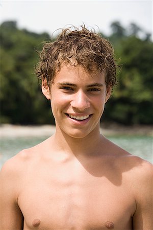 young man at the beach Stock Photo - Premium Royalty-Free, Code: 640-02657852