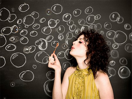 soplando burbujas - woman blowing bubbles Foto de stock - Sin royalties Premium, Código: 640-02657906