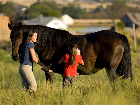 portrait photography with girls and horses - woman, girl, and a horse Stock Photo - Premium Royalty-Free, Code: 640-02658215