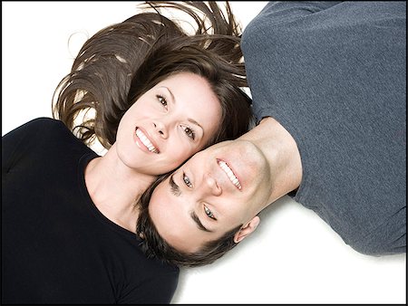 someone laying down aerial view - man and woman lying head to head Stock Photo - Premium Royalty-Free, Code: 640-02658364