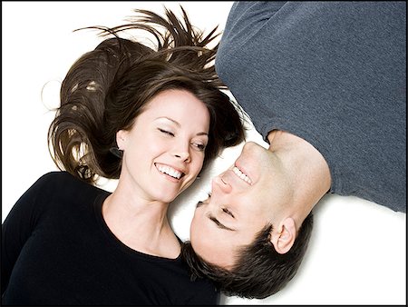 someone laying down aerial view - man and woman lying head to head Stock Photo - Premium Royalty-Free, Code: 640-02658363