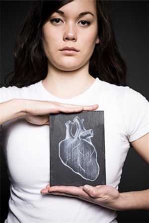 Woman with a drawing of a heart Foto de stock - Sin royalties Premium, Código: 640-02658476