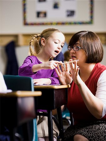 student portrait teacher not smiling - teacher in a classroom Stock Photo - Premium Royalty-Free, Code: 640-02658644