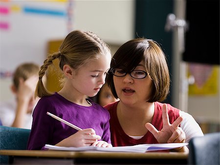 student portrait teacher not smiling - teacher in a classroom Stock Photo - Premium Royalty-Free, Code: 640-02658642