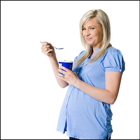pregnant women eat ice cream - pregnant woman Stock Photo - Premium Royalty-Free, Code: 640-02658938