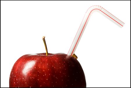 red delicious apple with a straw in it Stock Photo - Premium Royalty-Free, Code: 640-02659088
