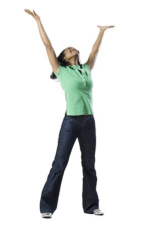woman in green shirt with arms outstretched Stock Photo - Premium Royalty-Free, Code: 640-02659175