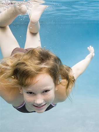 simsearch:640-02764438,k - Portrait of a girl swimming underwater Stock Photo - Premium Royalty-Free, Code: 640-02764434