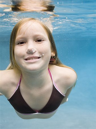 simsearch:640-02764438,k - Portrait of a girl swimming underwater Stock Photo - Premium Royalty-Free, Code: 640-02764436