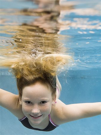 simsearch:640-02764438,k - Portrait of a girl swimming underwater Stock Photo - Premium Royalty-Free, Code: 640-02764437