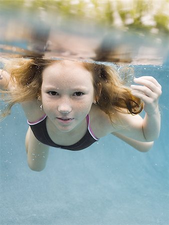 simsearch:640-02764438,k - Portrait of a girl swimming underwater Stock Photo - Premium Royalty-Free, Code: 640-02764433