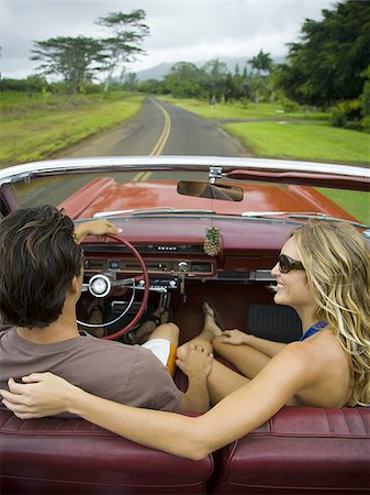 High angle view of a young couple sitting in the car Stock Photo - Premium Royalty-Free, Code: 640-02764477