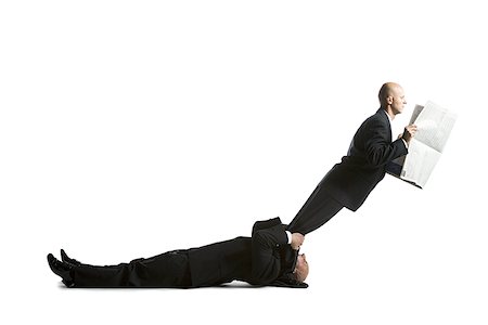 representing - Profile of two male acrobats in business suits Stock Photo - Premium Royalty-Free, Code: 640-02764546