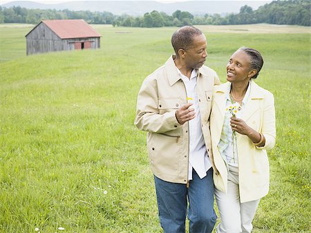 smiling elderly black man - Senior man and a senior woman looking at each other Stock Photo - Premium Royalty-Free, Code: 640-02764612