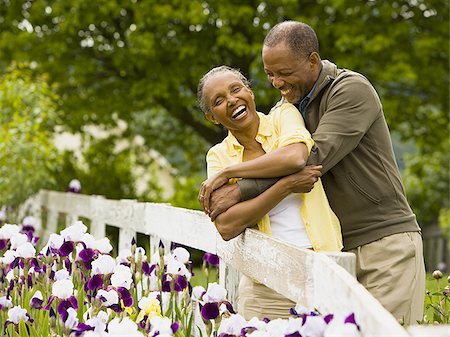 Senior man embracing a senior woman from behind Stock Photo - Premium Royalty-Free, Code: 640-02764666