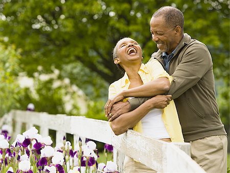 Senior man embracing a senior woman from behind Stock Photo - Premium Royalty-Free, Code: 640-02764669