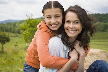 simsearch:640-01350562,k - Portrait of a girl hugging her mother from behind Stock Photo - Premium Royalty-Free, Code: 640-02764694