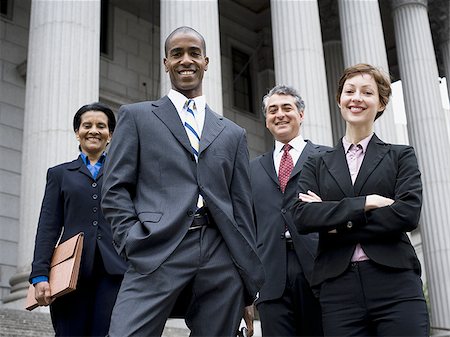 politician - Low angle view of lawyers in front of a courthouse Stock Photo - Premium Royalty-Free, Code: 640-02764725