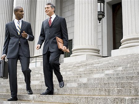 simsearch:640-02764731,k - Low angle view of two male lawyers talking on the steps of a courthouse Stock Photo - Premium Royalty-Free, Code: 640-02764728