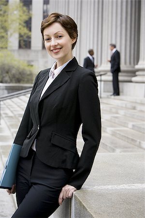 female lawyer portrait - Portrait of a female lawyer smiling Stock Photo - Premium Royalty-Free, Code: 640-02764731