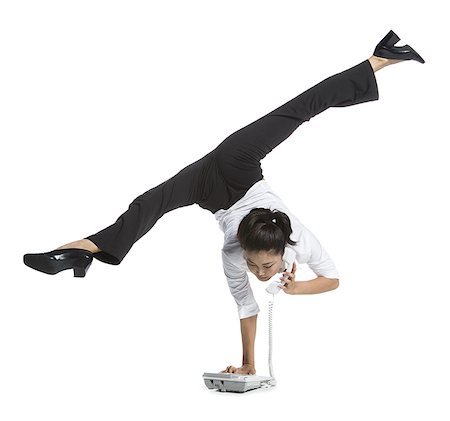 simsearch:640-02768591,k - Female contortionist businesswoman Stock Photo - Premium Royalty-Free, Code: 640-02764839