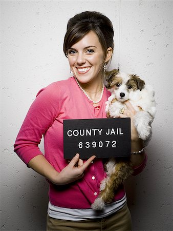 female in jail - Mug shot de femme avec chien Photographie de stock - Premium Libres de Droits, Code: 640-02765018