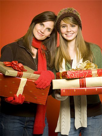 Mother and daughter with Christmas gifts Stock Photo - Premium Royalty-Free, Code: 640-02765043
